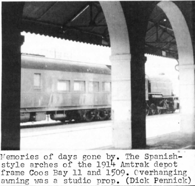 The train seen through depot arches